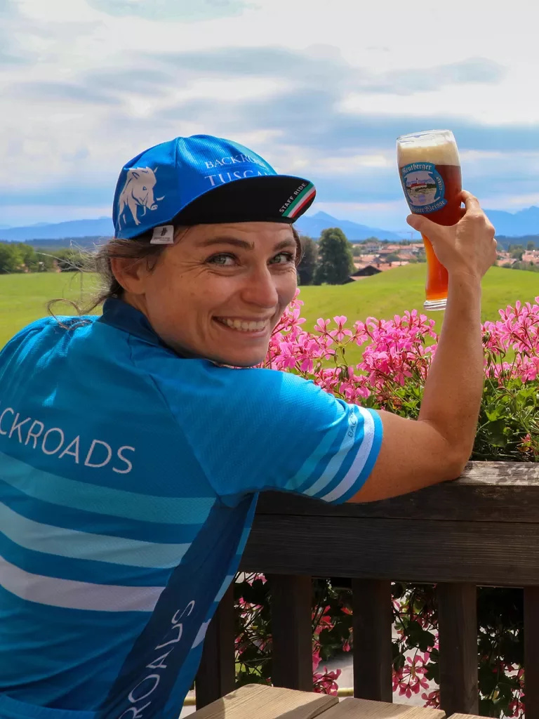 Backroads leader posing with pint of beer.