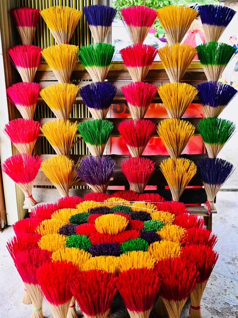 Large array of colorful incense sticks. 