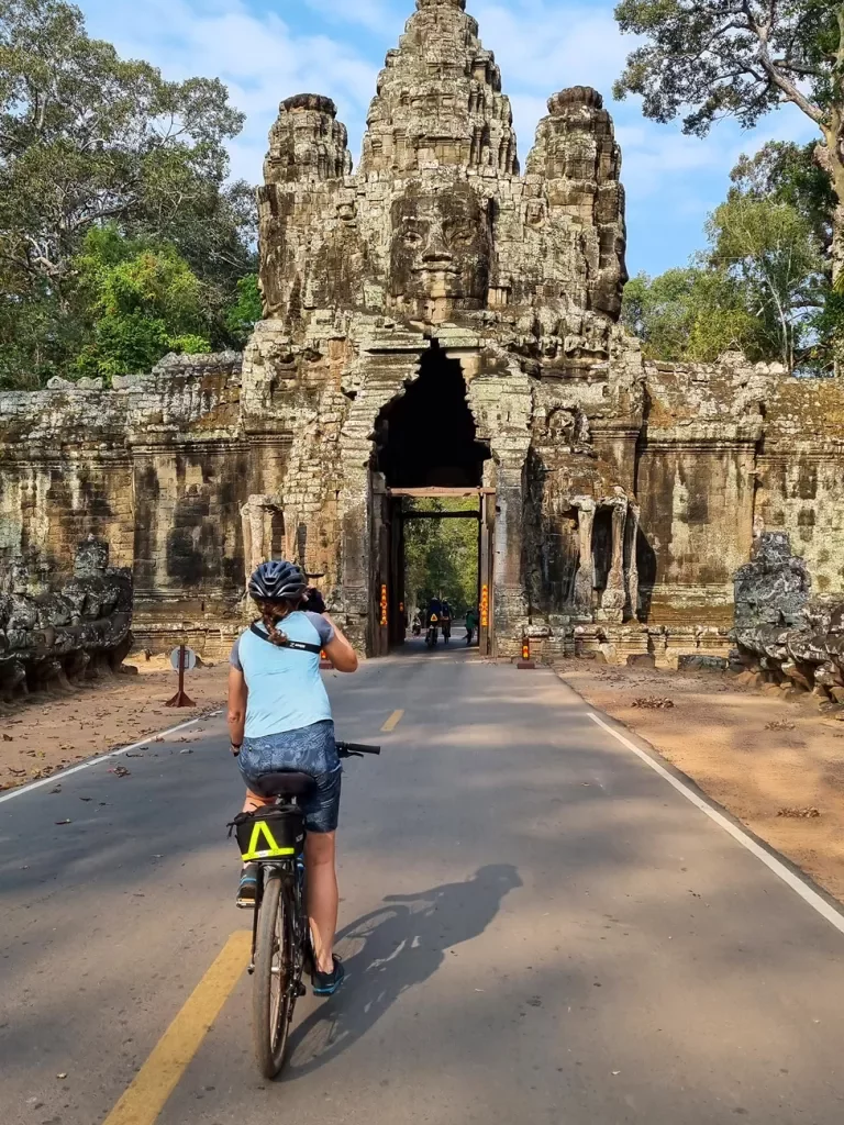 Biker riding toward Angkor Wat in Cambodia