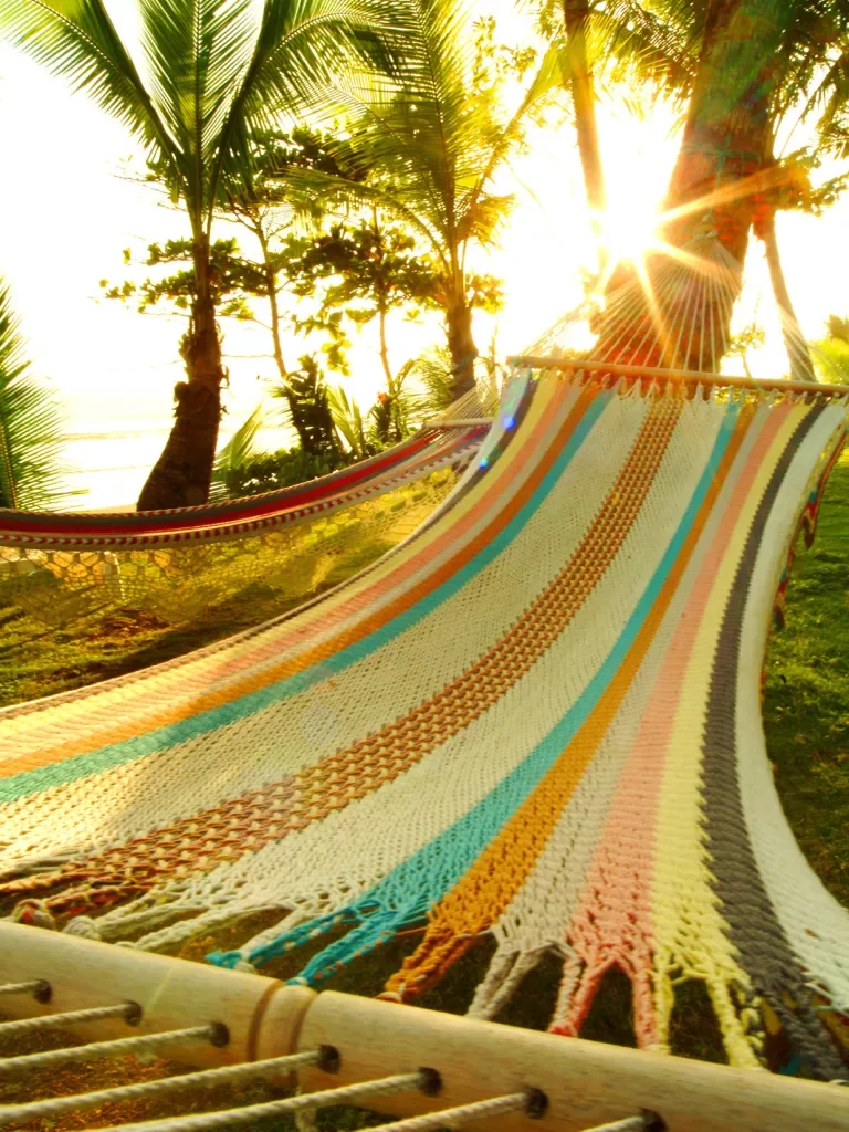 Close-up of multi-colored hammock, sunset.