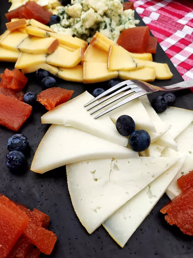 Close-up of cheese and fruit platter.
