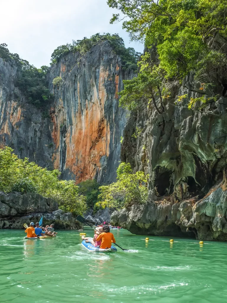 Kayaking among rock formations in Thailand