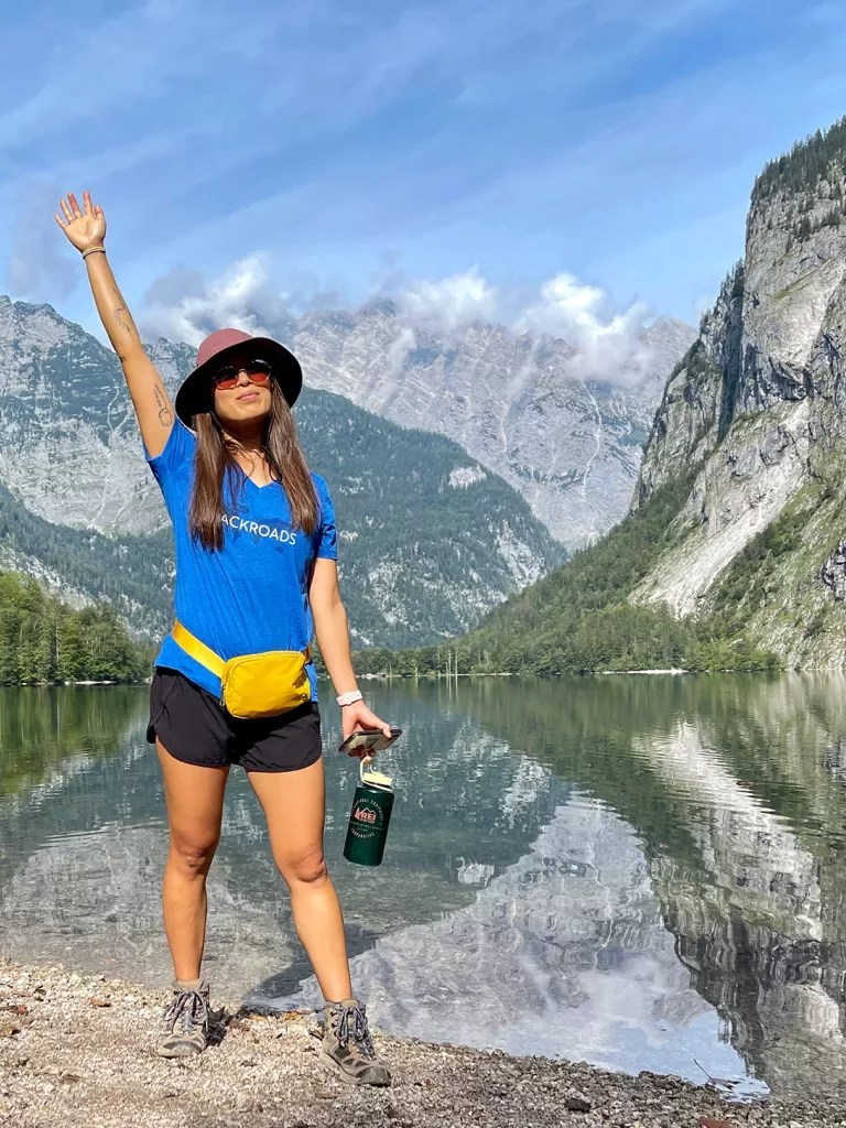 Hiker posing in front of lake in Bavaria.