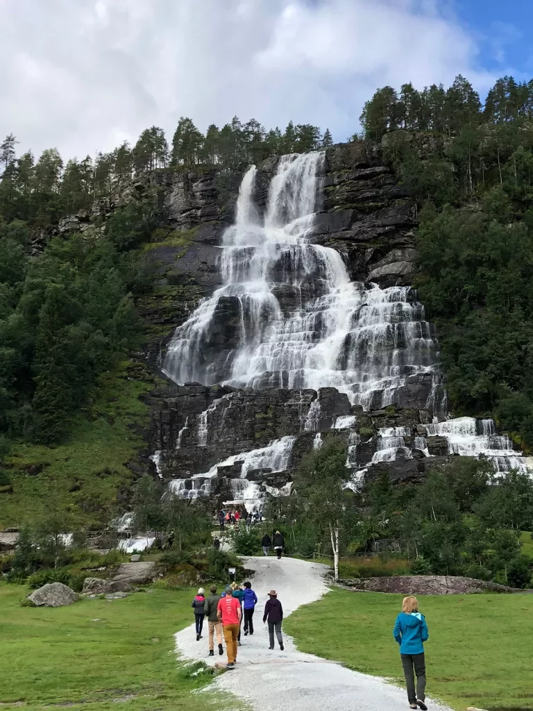 Waterfall cascading down a rocky cliff face in Norway