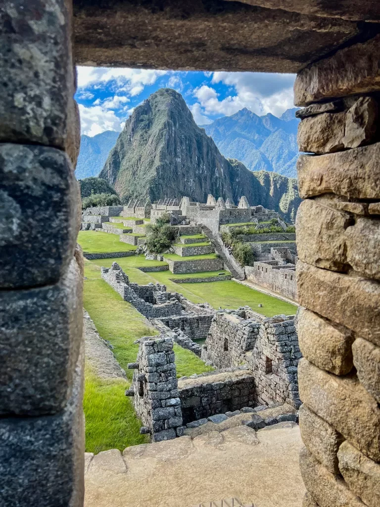Point of view shot out a stone window at Machu Picchu.