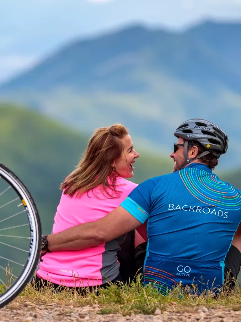 Backroads guests embracing one another after bike ride